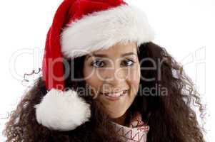 close view of young woman wearing christmas hat