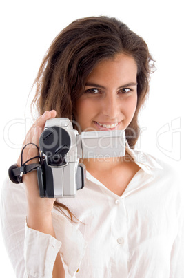 smiling woman holding video camera