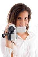 smiling woman holding video camera