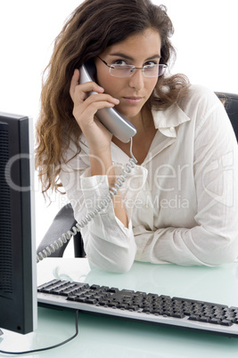 woman talking on phone and looking at camera