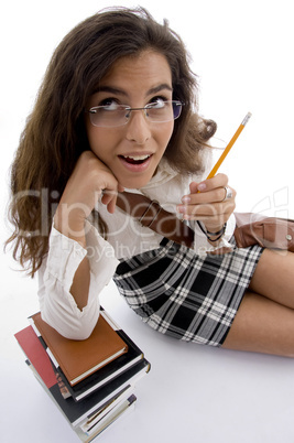 young student with books and pencil