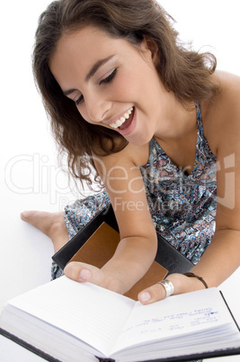 smiling young student reading book