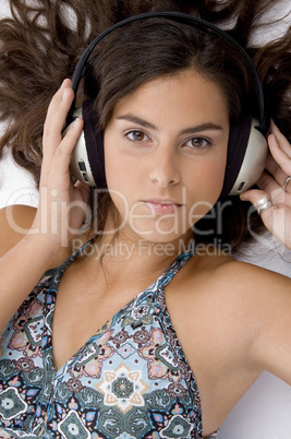 high angle view of high angle view of laying woman with headphone