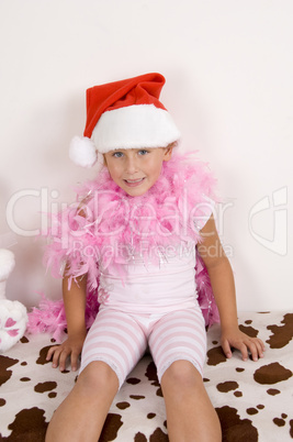 smiling cute girl wearing christmas hat