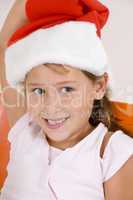 smiling little girl with christmas hat