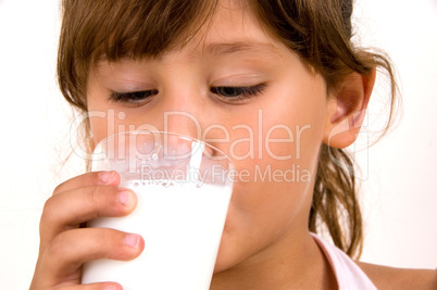 close up of little girl drinking milk