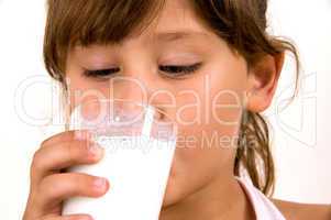 close up of little girl drinking milk