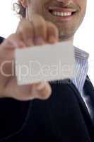 smiling ceo holding business card