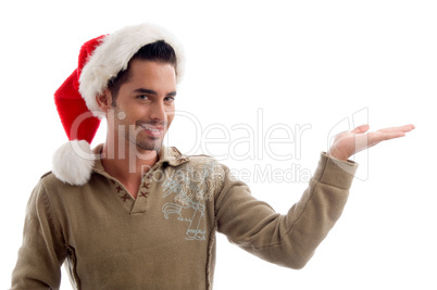 young male wearing christmas hat and holding something with hand gesture