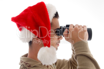 young guy watching into binoculars