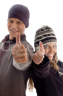 young couple showing thumbs up