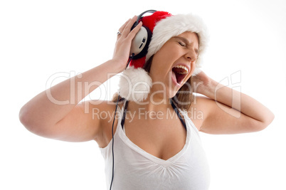 woman wearing christmas hat and enjoying music