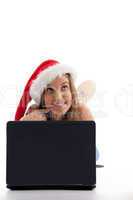 laying woman with christmas hat and notebook