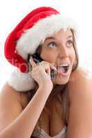 woman wearing christmas hat and talking on cell phone