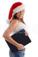 side pose of woman with christmas hat and laptop