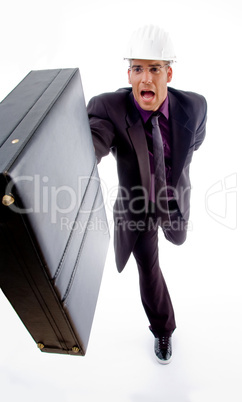 male architect holding office bag in running posture