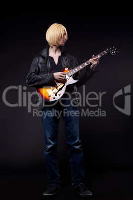 Young blond Man play on guitar cosplay character