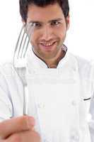 close up of chef holding fork