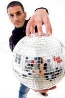 man holding disco ball like a globe