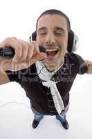 man listening music and singing into karaoke