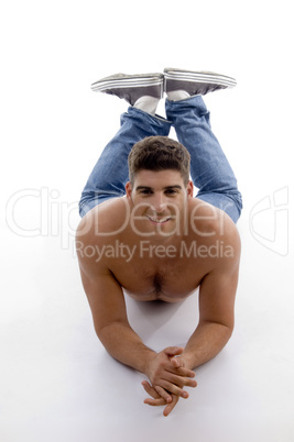 muscular male model lying and looking at camera