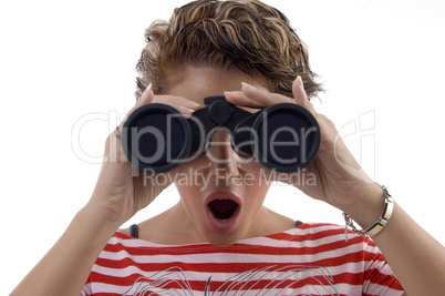 young woman looking through binocular