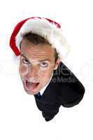 businessman wearing santa cap and teasing with tongue