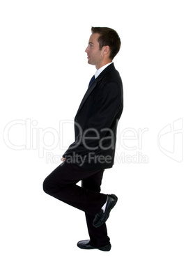 young businessman benting one leg