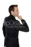 businessman with chin resting on hand