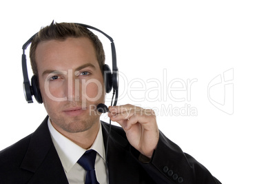 young businessman adjusting his headphone