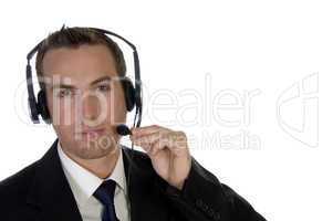 young businessman adjusting his headphone