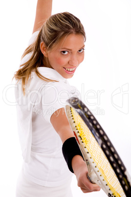 side view of smiling tennis player with racket