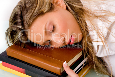 portrait of sleeping student on book