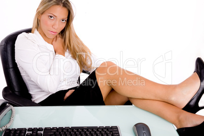 front view of sitting businesswoman looking at camera