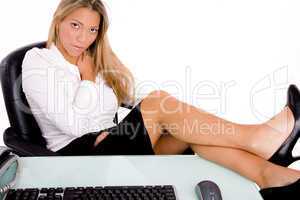 front view of sitting businesswoman looking at camera