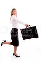 side view of smiling accountant holding briefcase
