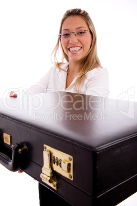 side view of smiling lawyer showing briefcase