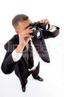 young accountant looking through binoculars