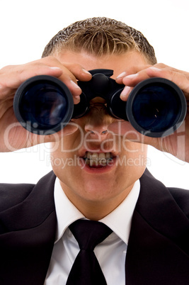 smart young lawyer angry while looking through binoculars