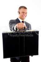 young corporate showing his briefcase