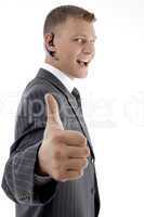 successful businessman showing thumbs up