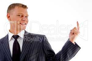 portrait of smiling pointing businessman