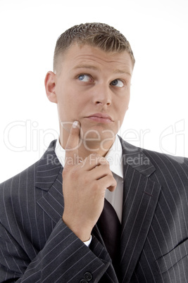 young thinking businessman looking upward