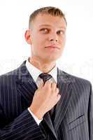 businessman adjusting his tie