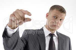businessman showing measuring gesture