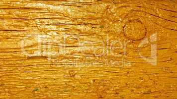 Wooden plank painted in golden