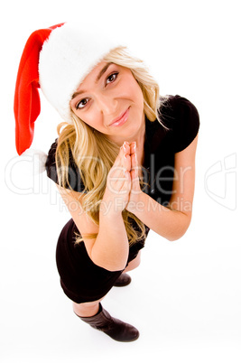 praying female wearing christmas hat