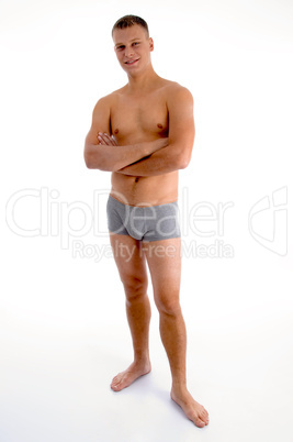 standing muscular man with crossed arms