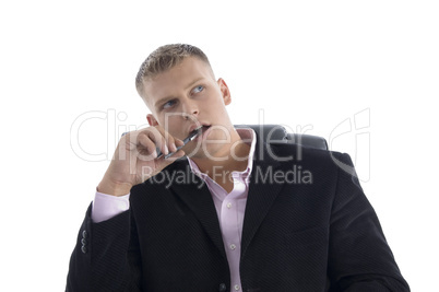 thinking young businessman looking upside