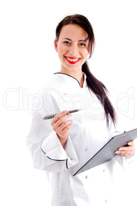 female chef writing down the menu